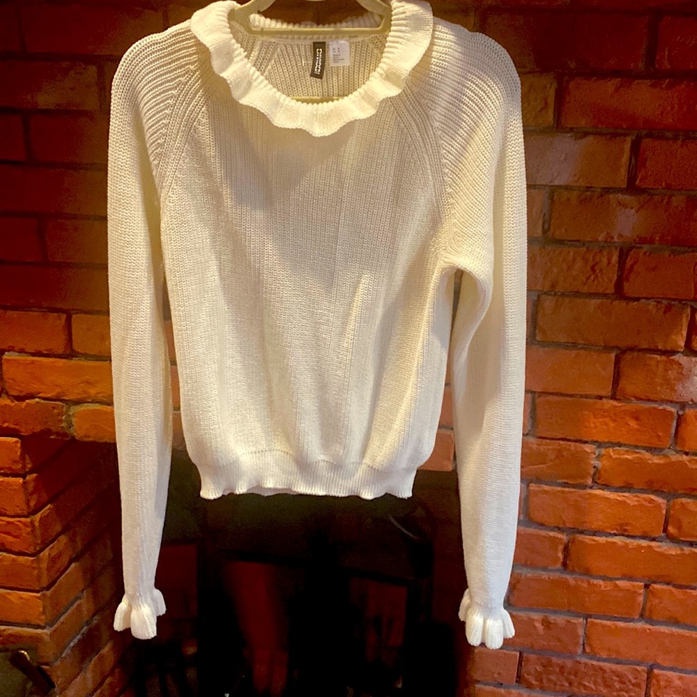 Cream colored H&M sweater with ruffle collar and Sleeve trim